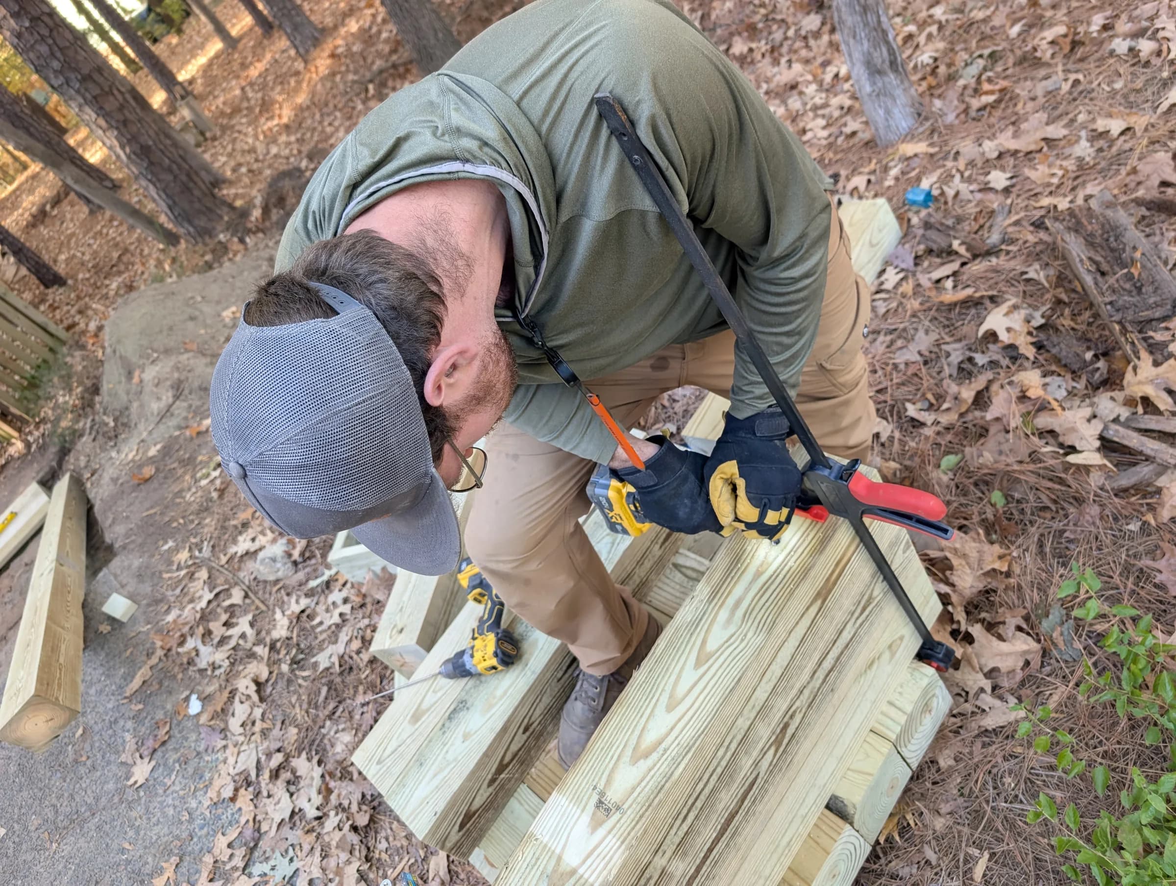 A Stillpoint builder working carefully on an outdoor project